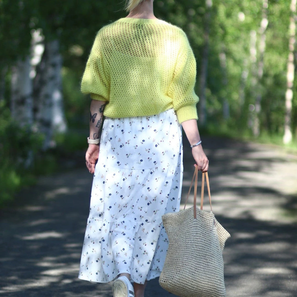 Hannemari Design suunnittelema Sunshine-villapaita tuo klassisen verkkopaidan tyylikkäästi tälle vuosituhannelle.